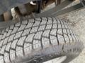 Close-up of a tire from a 2014 Ford F-350 SD showcasing tread design and depth