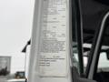 A 2020 International MV607 forestry truck with a label detailing specifications and identification information attached to the driver's side door