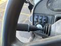 Close-up of the control panel of a 2013 JCB 510-56 Loadall featuring levers and various buttons for operating the machine