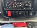Dashboard controls of a 2018 Hino 195 featuring climate control knobs multiple switches and an air conditioning button