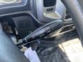 A control stick from the steering column of a 2020 Hino 338 displaying various function settings