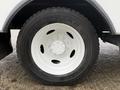 A close-up of a Goodyear tire mounted on a white wheel of a 2014 International TerraStar vehicle