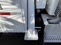 2008 Kenworth T370 with a white painted hitch connector and a warning label indicating a danger sign