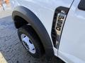 2024 Ford F-550 with a focus on the front wheel and fender showcasing the XL badge and F-550 emblem on the side