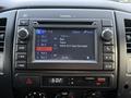Dashboard display of a 2013 Toyota Tacoma showing radio stations and audio settings