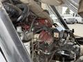 Close-up view of the engine compartment of a 2012 Global M4 showing various mechanical components and wiring