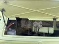 1976 GMC Motorhome engine compartment with visible components including hoses battery and mechanical parts