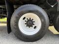 Close-up of a Goodyear G28 MSD tire on a 2011 International 7500 truck showing the wheel rim and lug nuts