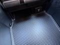 A 2023 RAM 3500 with a textured rubber floor mat displaying a compartment for power outlets