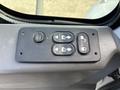 Control panel with buttons for windows and doors in a 2012 International DuraStar 4300