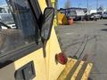 A 1993 Hyster H80XL forklift with a yellow and black exterior featuring a side mirror and a red rear light