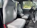 Interior of a 2018 Ford F-750 featuring two gray seats with armrests and a central console between them