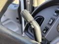 Close-up of a control lever on a 2006 Freightliner M2 106 with labeled settings for lights and wipers