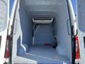 Interior view of a 2021 Mercedes-Benz Sprinter 2500 with a blue insulated cargo space featuring an overhead air conditioning unit and open floor area