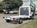 A 2023 RAM Promaster 3500 cab chassis with a white exterior and an open cargo bed designed for customization