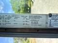 A 2012 Ford Econoline vehicle door label displaying tire information vehicle identification number and compliance details