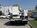 A white 2008 Ford F-550 utility truck equipped with a bucket lift attached to the rear