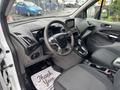 Interior view of a 2019 Ford Transit Connect showcasing the steering wheel dashboard and front seats with a thank you mat on the floor