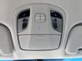 Control panel of a 2015 Hyundai Sonata including buttons for door and room lights with indicators for the windows