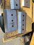 A set of metal blades with multiple holes for attachment designed for a Vermeer Corporation BC1200XL chipper machine