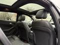Interior view of a 2016 Mercedes-Benz GLA-250 featuring leather seats and a panoramic sunroof