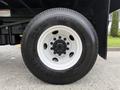 A close-up view of a 2017 Ford F-750 tire showing the rim and tread pattern with the brand name Double Coin visible on the sidewall