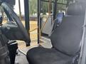 Interior view of a 2020 Chevrolet Express showing the driver's seat and steering wheel