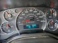 Dashboard of a 2023 GMC Savana displaying speedometer gauge engine hours and various indicator lights