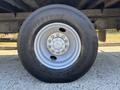 Close-up of a 2020 Hino 338 tire featuring a silver wheel rim and the Bridgestone logo on the tire sidewall