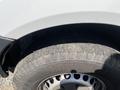 Close-up of a tire from a 2016 Mercedes-Benz Sprinter showing tread patterns and details of the wheel rim