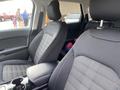 A 2017 Ford Edge interior featuring front seats with black fabric upholstery and a console between them