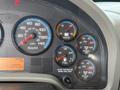 Dashboard of a 2008 International 4300 featuring speedometer, fuel gauge, voltmeter, and air pressure gauges