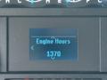 A digital display showing the engine hours of a 2023 Ford E-450 reading 1370