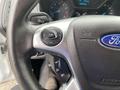 Steering wheel of a 2017 Ford Transit Connect featuring control buttons for navigation and settings