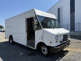 A 2012 Ford Econoline box truck with a white exterior featuring a large cargo area and an open driver's side door