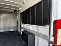 Interior view of a 2017 RAM Promaster van showing a spacious cargo area with metal walls and a black storage box on the floor