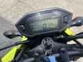 A 2018 Honda Grom motorcycle dashboard displaying speedometer and odometer readings with a key in the ignition