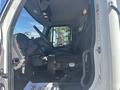 Interior view of a 2022 Freightliner M2 106 showing the driver's seat steering wheel and dashboard controls