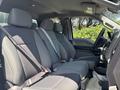 Interior of a 2019 Ford F-150 with a row of gray fabric seats and seat belts visible