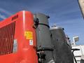 A 2018 Sandvik Ranger DX800 drill rig featuring a red and gray exterior with various mechanical components and warning labels on the side