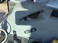 Control panel of a 2010 New Holland T4050 tractor featuring switches and levers for operation and safety indicators