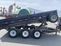 2009 Load 16 foot Dump Trailer with a raised bed and three wheels visible, displaying a black body with a logo on the side