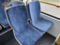 Two blue bus seats with a pattern of light-colored shapes, designed for public transportation in a 2016 Grande West Vicinity