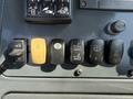 Control panel of a 2013 John Deere 710K featuring various switches for equipment functions