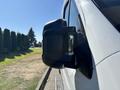 Side mirror of a 2020 RAM ProMaster 3500 van showing a black housing and a rectangular mirror surface