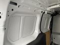 Interior view of a 2017 Ford Transit Connect showing the cargo area with white walls and a flat floor