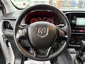 The steering wheel of a 2017 RAM ProMaster City featuring the brand logo and control buttons for audio and cruise functions
