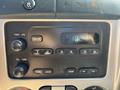 Dashboard of a 2011 Chevrolet Colorado featuring a radio with knobs for power and volume as well as buttons for tuning and audio settings displaying the time 1024