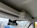 Interior view of a 2020 RAM Promaster showing overhead storage and a digital display mounted on the dashboard