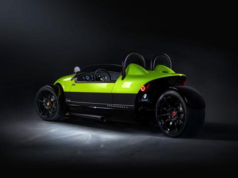 A sleek 2024 Vanderhall Carmel sports car with a vibrant green body and black accents featuring two high-backed seats and exposed wheels